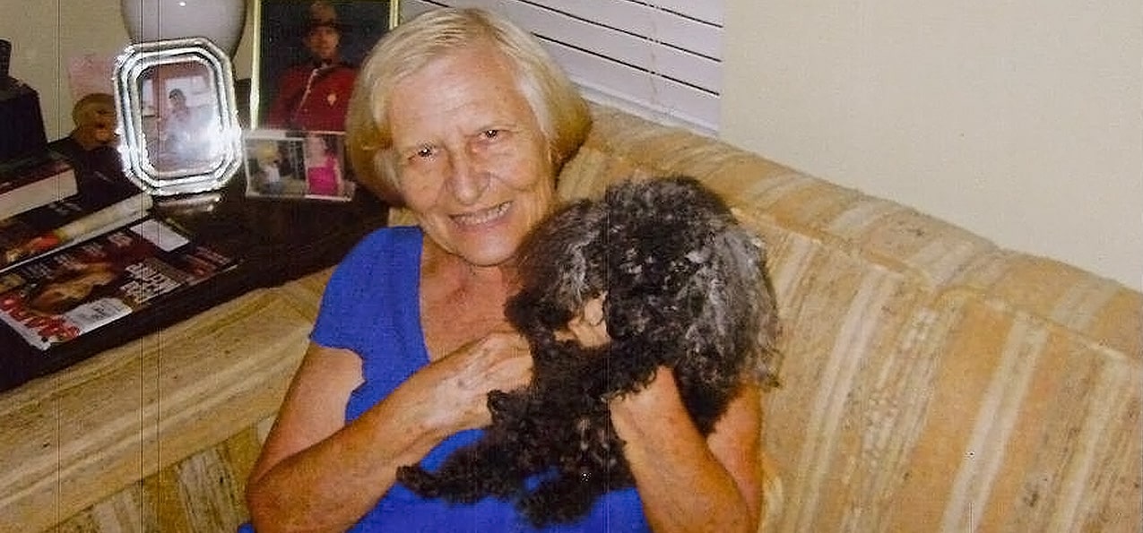 Jeannette holding her poodle Babette on her 19th birthday.